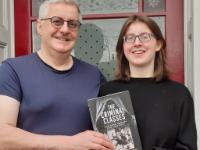 Alex and her dad, Barry, with the new book.